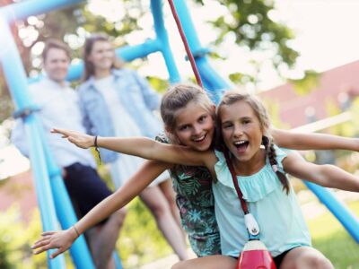 joyful-family-having-fun-on-playground-2022-05-20-07-46-08-utc