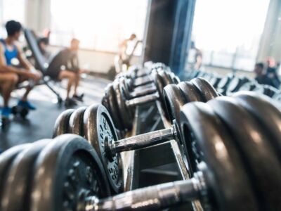 metal-heavy-dumbbells-in-holder-in-modern-gym-2021-08-26-12-09-03-utc